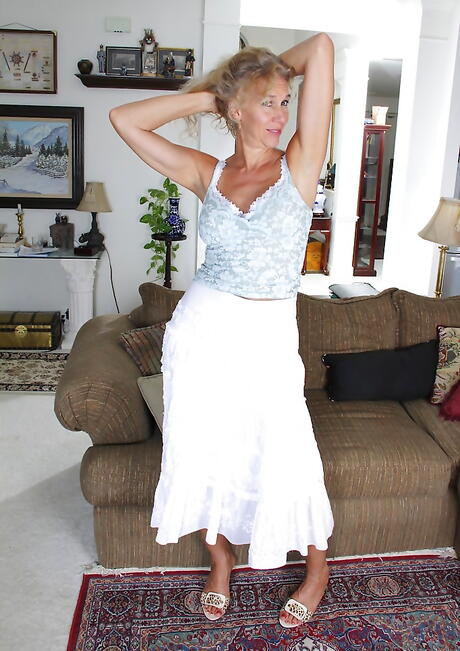 Very attractive british mature Cally Jo in sexy skirt exhibiting big hooters and masturbating 