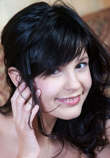 Hot dark-haired young Zelda B exhibits her butt and spreads her legs 